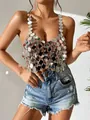 Close-up of shiny silver acrylic disc sequins on a sexy backless halter top for parties - One Size / Tops / Silver
