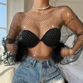 Close-up detail of women's black rhinestone mesh long sleeve top featuring faux feather cuffs - XS / Tops / Black