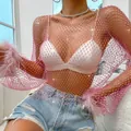 Close-up detail of pink fishnet mesh top with glitter rhinestones and feather cuffs - XS / Tops / Pink