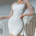 Close-up of the sparkling rhinestone hollow-out mesh detail on white bodycon dress - XS / White