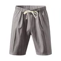 Macro view of men's grey vertical striped linen beach shorts with cream drawstring detail. - Light Gray