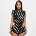 Close-up detail of a polka dot sleeveless romper with sexy side cut-outs in black and white - S / Top And Bottom / Polka Dot