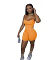 Combinaison de sport orange sexy sans manches présentée sur un mannequin en studio. - S / Haut Et Bas / Orange