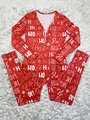 Detailed macro view of the Christmas themed HO HO HO pattern on red festive jumpsuit - S / Top And Bottom (D9468) / Red