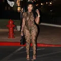 Sexy brown snakeskin print sheer mesh jumpsuit with high neck worn by model at night - Snake Print