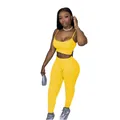 Full-length view of a yellow two-piece set featuring a cami crop top and fitted leggings. - S / Top And Bottom / Yellow