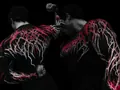 Detail view of Breathedivinity men's gym compression shirt with skull and red branch print - S / Tops / Black With Red Bloom Print