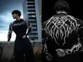 Detailed view of men's black compression shirt with white gothic thorn and skull prints - S / Tops / Black White