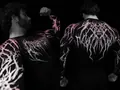 Detailed view of men's black compression gym shirt with pink gothic thorn pattern - Black And Pink