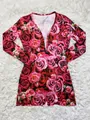 Detailed view of long sleeve romper with vibrant red and pink rose floral pattern. - S / Top And Bottom / Red Rose