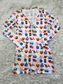 Detail of white long-sleeve bodysuit with colorful Valentine heart and bird print - Red Blue White