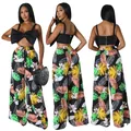 Detailansicht des Damen-Sets mit floraler Weitbeinhose und schwarzem Schleifen-Crop-Top. - S / Unterteile / Schwarz