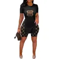 Ensemble deux pièces noir pour femme avec imprimé monogramme doré et haut fendu élégant - S / Haut Et Bas / Noir Lettre