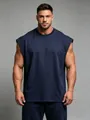 Macro view of navy blue sleeveless gym vest showing fabric texture and fit - S / Tops / Navy Blue