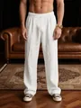 Macro detail view of men's loose white linen-style trousers with drawstring waist. - S / Bottoms / White