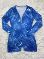 Close-up of Sagittarius constellation print and snap buttons on blue long sleeve romper - Sagittarius