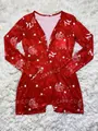 Detailed view of the Capricorn zodiac constellation print on red long-sleeved home romper - Capricorn
