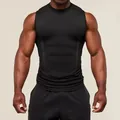 Detailed view of men's black compression tank top highlighting fabric texture and fit - S / Tops / Black