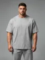 Detailansicht eines grauen, lockeren Sport-T-Shirts für Herren mit Fokus auf Stofftextur - S / Oberteile / Meliertes Grau