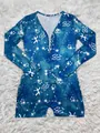 Macro view of blue long sleeve romper featuring white Pisces zodiac and constellation print. - Pisces