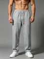 Detail view of men's loose grey sweatpants showing premium cotton texture and fit - S / Bottoms / Marl Grey
