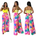 Modisches zweiteiliges Set mit gelbem Crop-Top und pinker Hose mit tropischem Blumenmuster. - S / Unterteile / Rosa