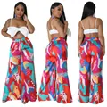 Drei-Winkel-Ansicht bunte bedruckte Weithose mit weißem Bow-Tie-Crop-Top - bunt