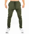 Detailed view of men's olive green slim fit gym joggers featuring articulated knees - M / Bottom (With Logo) / Army Green