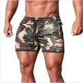 Close-up of men's camouflage mesh athletic shorts featuring breathable quick-dry fabric - M / Bottoms / Camouflage