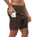 Close-up detail showing the inner phone pocket of these brown 2-in-1 men's running shorts - M / Bottoms / Brown