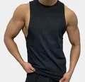 Close-up of black men's sleeveless gym tank top showing athletic fit and muscle detail - M / Tops / Black