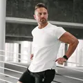 Athletic white muscle fit men's T-shirt with curved hem for bodybuilding and training - M / Tops / White