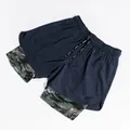 Detail view of men's double-layer athletic shorts featuring camouflage lining and pockets - Navy Blue
