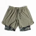 Detailed view of olive green double-layer running shorts with camo lining - M / Bottoms / Army Green