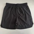 Close-up front view of black quick-dry men's athletic shorts with elastic drawstring waist - S / Bottoms / Black