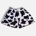 Close-up detail of breathable mesh material on high street cow print sports shorts - S / Bottoms / Black White Cow Print