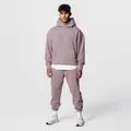 Full view of men's oversized mauve hoodie and sweatpants set in a studio setting. - Mauve