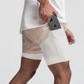Men's double-layer sports shorts in beige with built-in phone pocket and mesh detail. - Light Khaki with White
