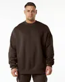 Front view detail of a dark brown oversized crewneck sweatshirt on a male model - Brown