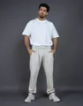 Full detail shot of unisex oversized beige 400g fleece sweatpants for winter outfits - S / White