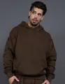 Close-up of heavy 400g fleece brown hoodie showing loose fit and premium fabric texture. - Brown