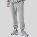 Pantaloni della tuta unisex grigi foderati in pile, vestibilità ampia e polsini. - grigio melange