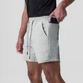 Detailed view of grey men's athletic shorts featuring a convenient side phone pocket - S / Bottoms / Heather Grey