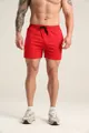 Detailed view of the red athletic shorts' fit and texture on a muscular male model - S / Bottoms / Red