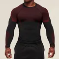 Detail of men's quick-dry compression long-sleeve T-shirt in maroon and black - S / Tops / Black and Red