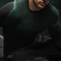 Close-up detail of men's breathable compression sports top with green mesh fabric - Black and Green
