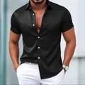 Close-up detail of a men's black short-sleeve shirt in premium luxury shiny satin fabric - S / Tops / Black