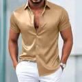 Detail view of champagne gold satin short sleeve shirt showing shiny fabric texture - Dark Khaki
