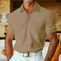 Detail view of men's waffle knit polo shirt in khaki with button collar and short sleeves. - Camel