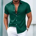 Detail shot of emerald green men's short sleeve shirt with a silky satin finish - S / Tops / Green